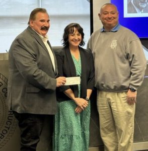 Local 2 IUEC president presents a donation of $71,000 to DRI